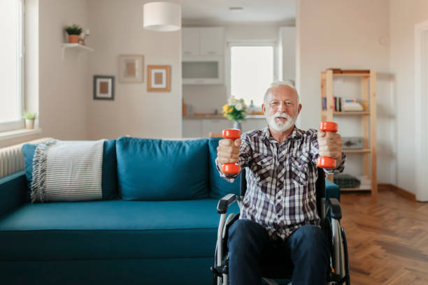 istock Senior Man in a Wheelchair using Dumbbells 1183364699