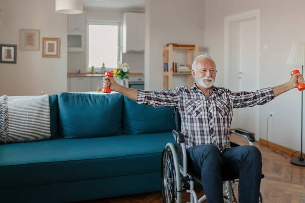 istock Senior Man in a Wheelchair using Dumbbells 1183364783