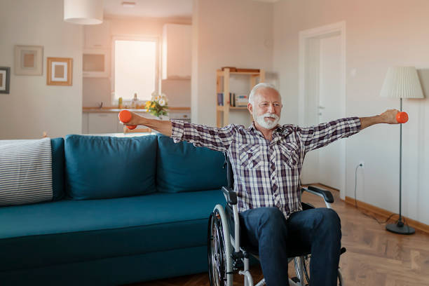 istock Senior Man in a Wheelchair using Dumbbells 1183364784