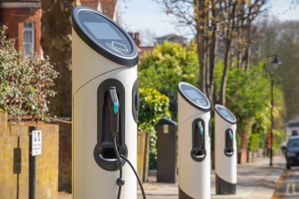 Electric car charging station on London street Electric car charging station around Crouch End area on London street battery charger stock pictures, royalty-free photos & images
