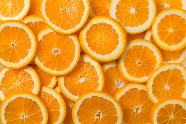 istock Fresh chopped orange slices full frame background 1183369248
