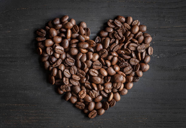 Heart-shaped coffee beans stock photo