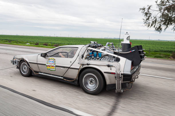 DMC DeLorean, Back to the future car, during Fireball Transcontinental Run 2010 event DMC DeLorean with parts added and inspired by the movie trylogy "Back to the future" car during Fireball Transcontinental Run 2010 event. Photo taken on the highway to Los Angeles. time machine stock pictures, royalty-free photos & images