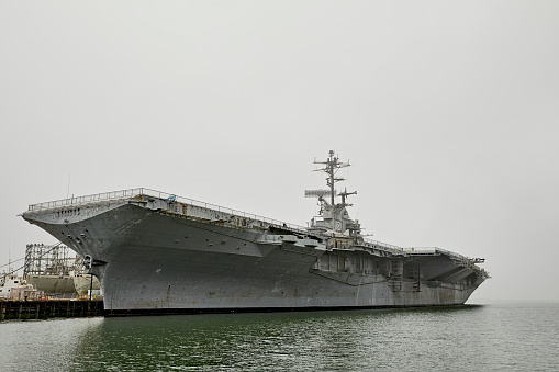 Aerial view of naval ship travelling in San Diego Bay, San Diego, California, USA.