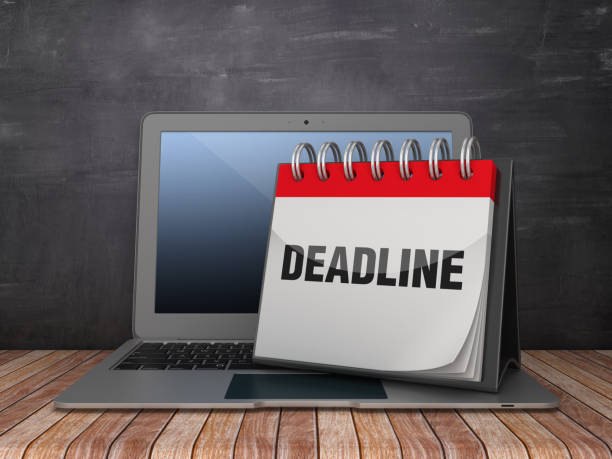 istock DEADLINE Calendar with Computer Laptop on Chalkboard Background - 3D Rendering 1183372162