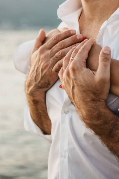 istock A woman hugs a man. 1183373678