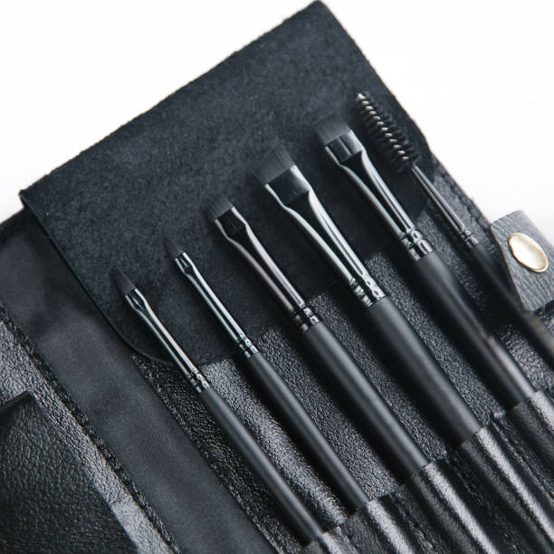 istock Set of black eyebrow brushes. Leather case with makeup brushes. 1183374693