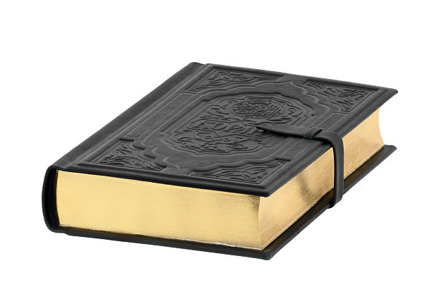 istock Closed Holy Koran book isolated on white background 118337524