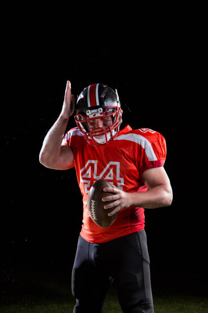 istock Football player portrait on black background 1183375306
