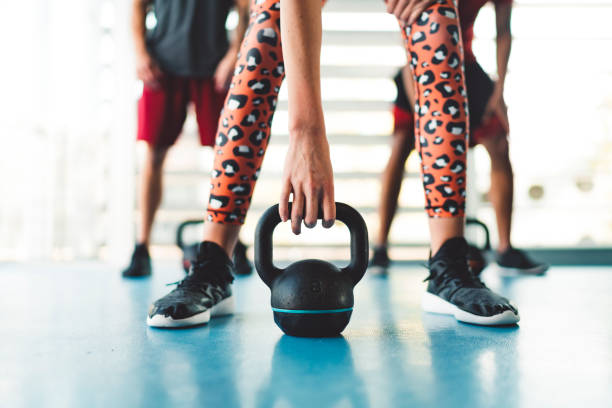 istock Woman hand holding a kettlebell 1183377911