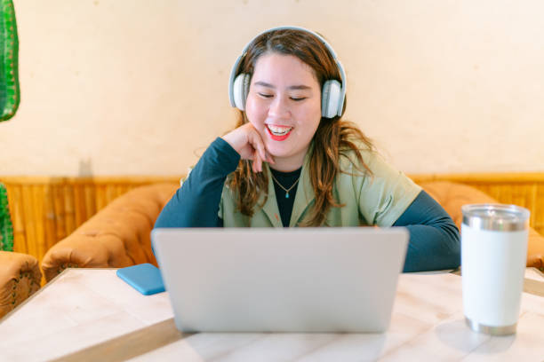 istock Young freelance woman working remotely 1183385980
