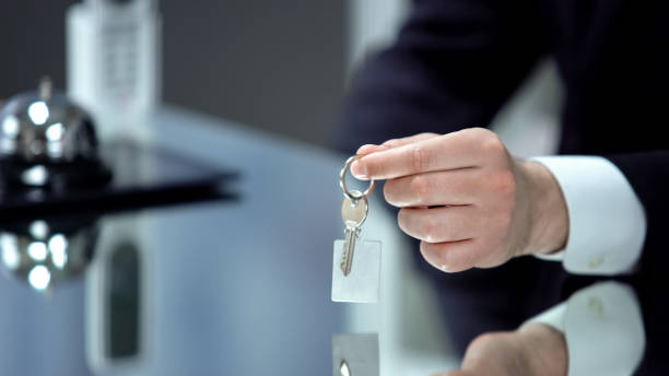 istock Worker on reception giving key from room, check in to luxury hotel, high quality 1183388501