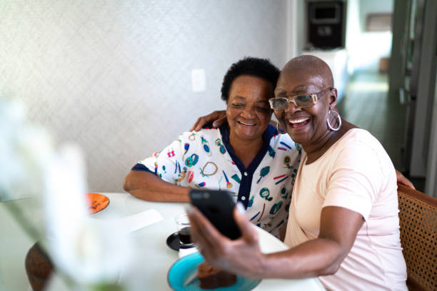 istock Senior women doing a video call using smartphone 1183389314