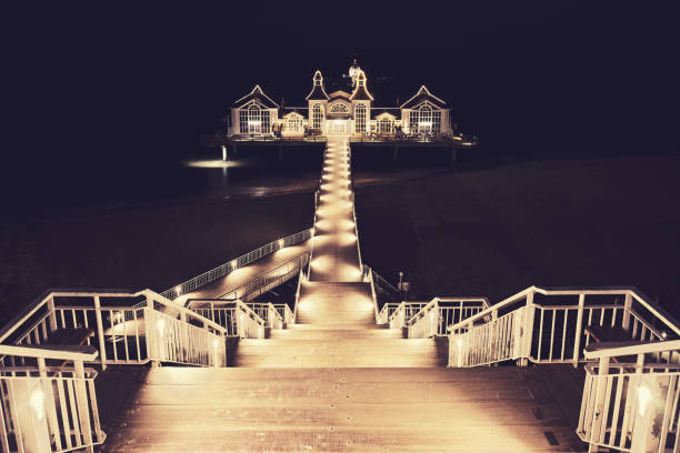 istock Pier in Sellin at night, Germany. 1183394844