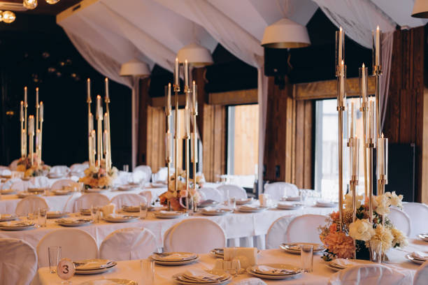 istock high decorative candles table decoration at a wedding 1183404450