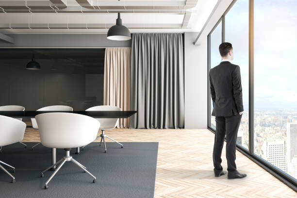 istock Businessman in bright meeting room 1183405872