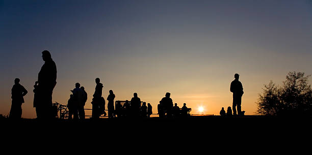 istock silhouette group of people against sunset 118340618