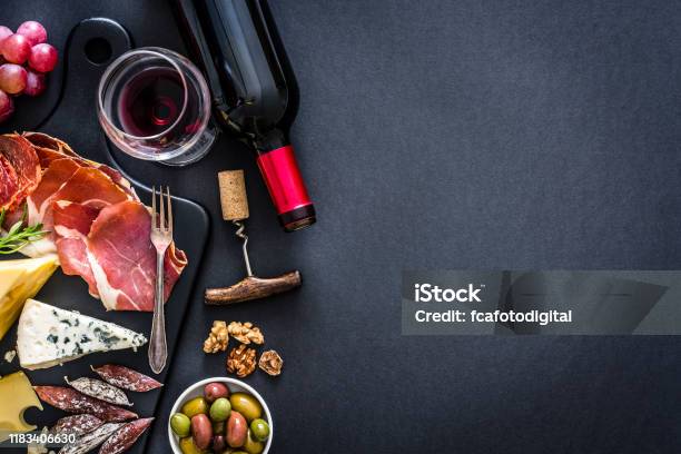 Appetizer Frame Red Wine Iberico Ham And Cheese On Rustic Table Stock Photo - Download Image Now