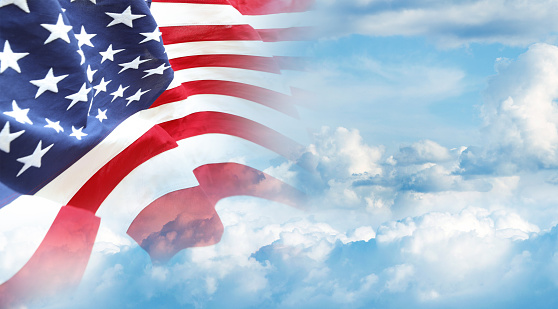 American flag in blue sky