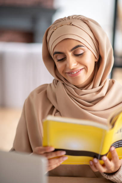 istock Young girl feeling interested and inspired by reading 1183408515