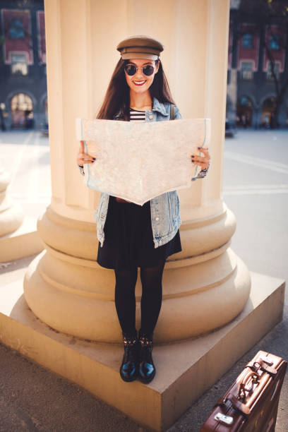 istock Tourist holding a map of city 1183409430