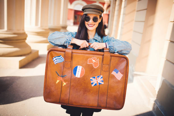 istock Beautiful traveler with retro suitcase 1183411087