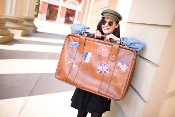 istock Retro suitcase in traveler's hands 1183411429