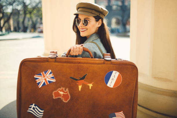 istock Tourist and retro suitcase 1183412296