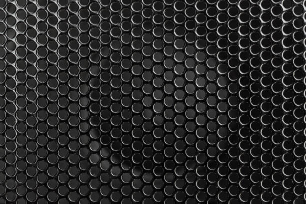 istock Black metal grid on audio speaker. Audio speaker texture. Macrophoto. Abstract background. 1183412671