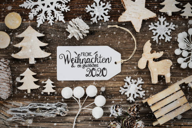 Label, Frame, Decoration, Glueckliches 2020 Means Happ 2020, Snowflakes One White Label With German Text Frohe Weihnachten Und Ein Glueckliches 2020 Means Merry Christmas And A Happy 2020. Frame Of Christmas Decoration Like Tree, Sled, Star, Fir Cone And Snowflakes. happ stock pictures, royalty-free photos & images