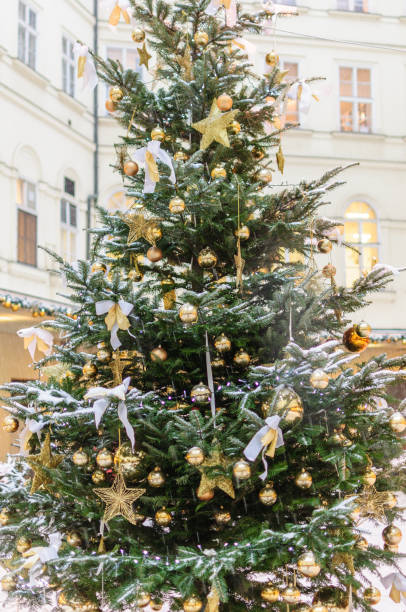 istock Christmas decorations and snow on pine tree 1183422332