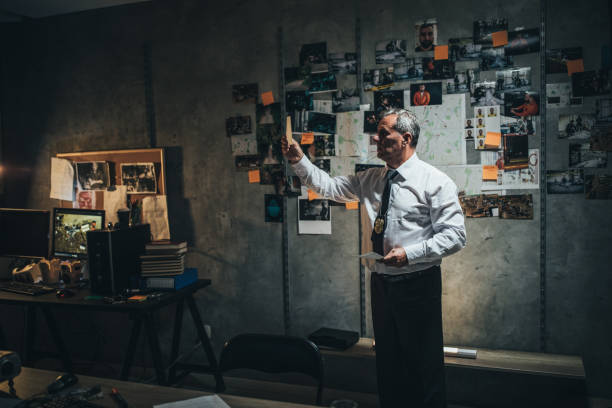 istock Mature detective examining evidences 1183423641