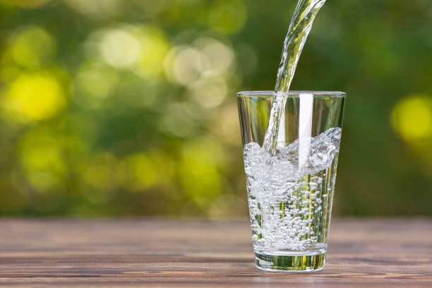 istock water pouring into glass 1183425054