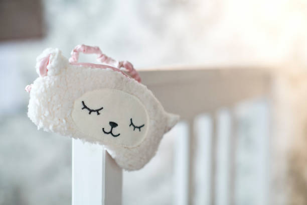 Pink color handmade soft textile doll toy on white background.  Toy for baby