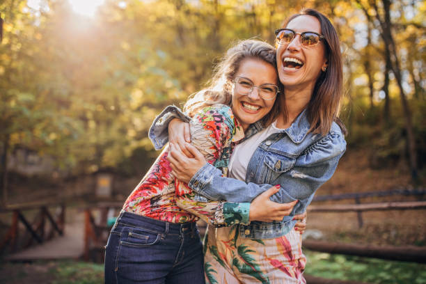 istock happy friends in park 1183427195