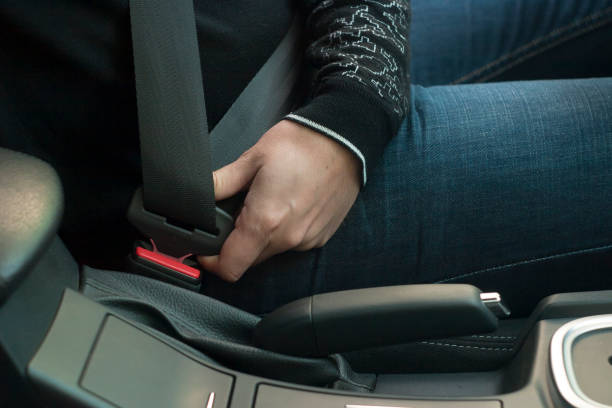 istock The driver fastening car seat belt 1183428426