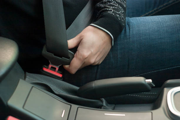istock The driver fastening car seat belt 1183428434