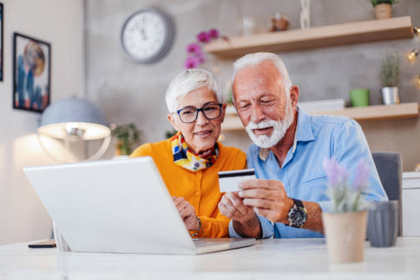 istock Senior couple shopping online. 1183428504