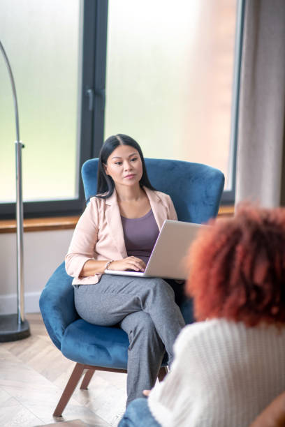 istock Dark-haired psychoanalyst listening to her client attentively 1183429798