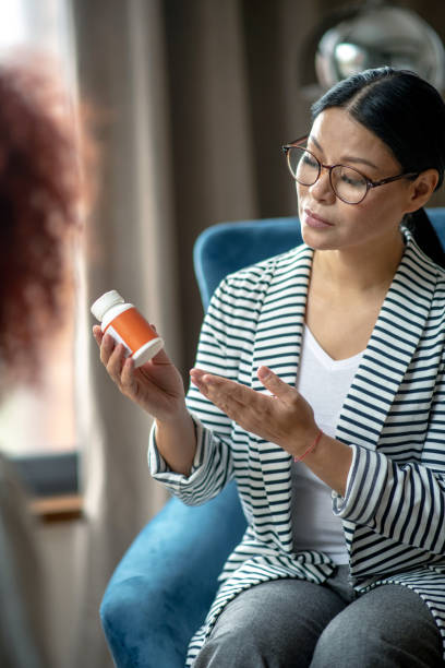 istock Professional female psychoanalyst recommending antidepressants to client 1183429964