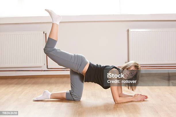 Woman Stretching Leg Stock Photo - Download Image Now - Adult, Adults Only, Aerobics