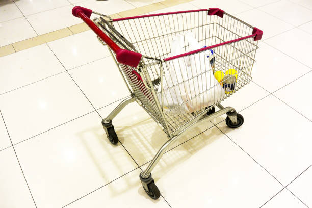 istock Supermarket shopping cart with red handle 1183438348