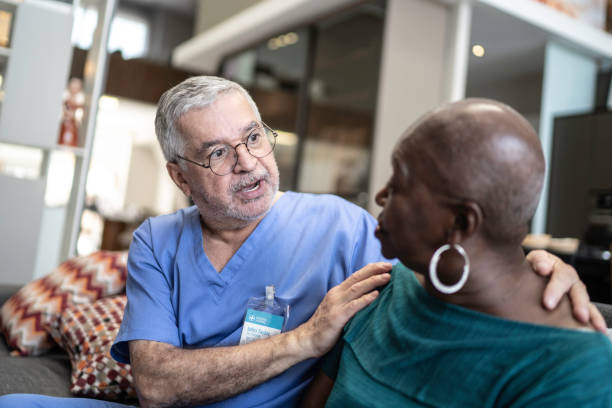 istock Doctor and patient talking at home 1183441543