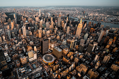 High angle view of a Manhattan metropolitan area, taken at sunset from a helicopter.