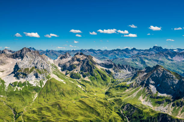 View to the Alps in Austria Awesome view from the mountain Spuller Schafberg to the Lechquellen mountains at the Lech valley in Vorarlberg, Austria. european alps stock pictures, royalty-free photos & images