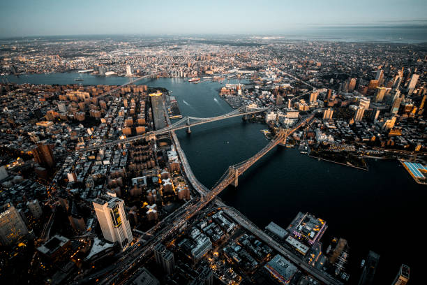 istock Brooklyn Bridge, Manhattan Bridge, and Williamsburg Bridge captured from air over the Lower Manhattan at dusk 1183442246