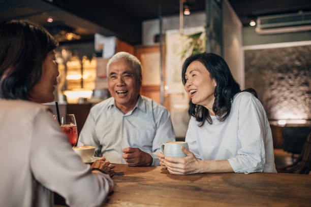 istock Friends drinking coffee in cafe 1183447516