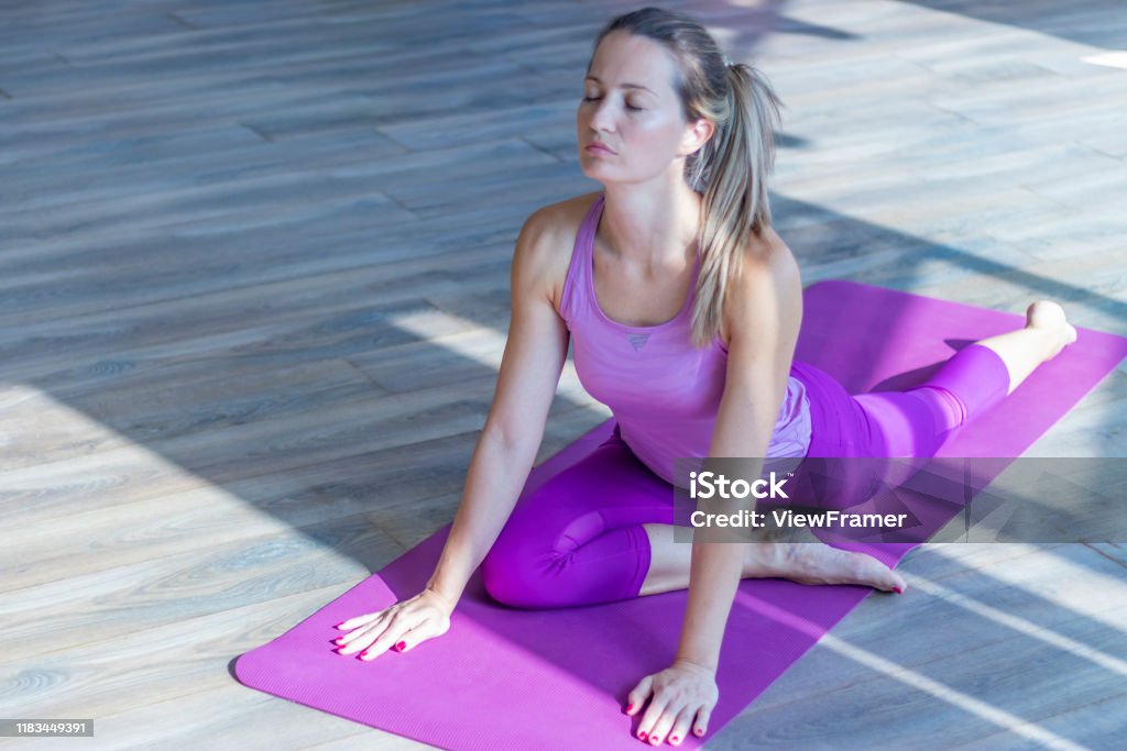 Beautiful woman stretching hip Hip - Body Part Stock Photo