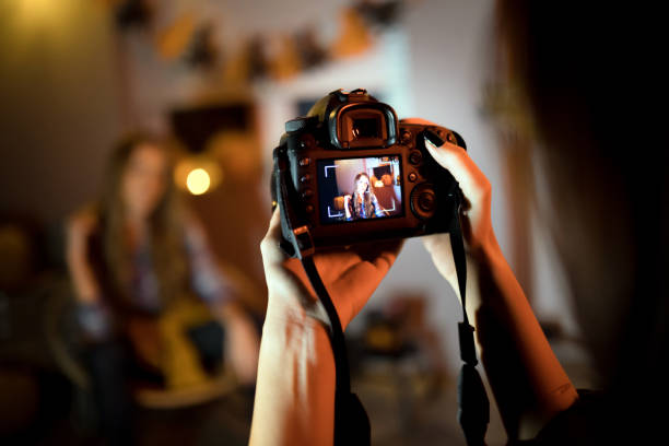 istock Taking picture of halloween scene with camera 1183449784