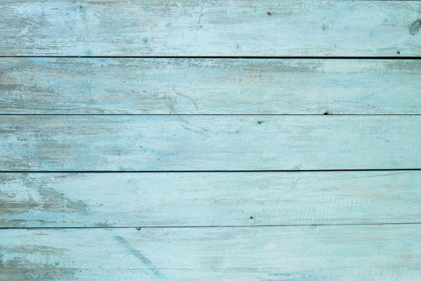 istock old wooden fence light blue paint peeling board texture. Background 1183449805